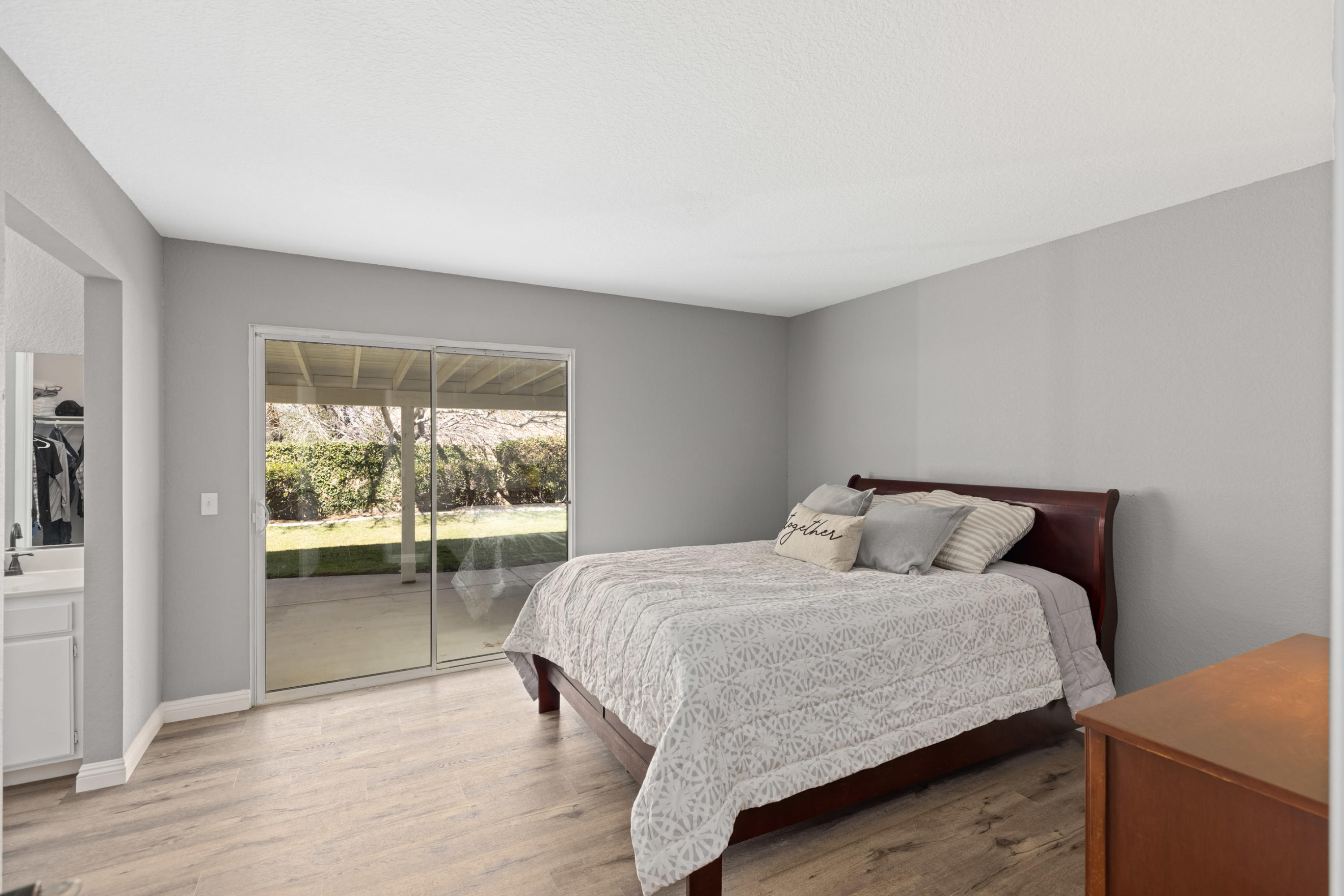 40325 Argyle Lane Palmdale, CA 93551 - Photo 10 of 24 a bedroom with a bed and a large window