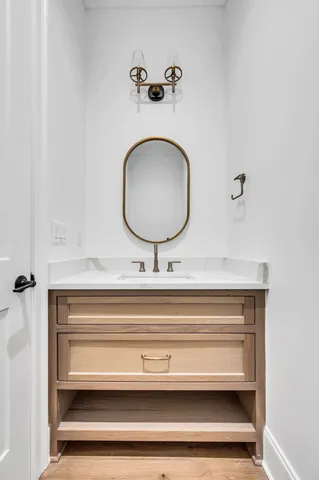 a bathroom with a double vanity sink and a mirror