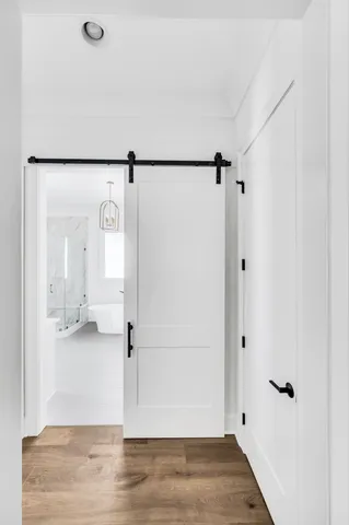 a spacious bathroom with a tub sink shower and mirror