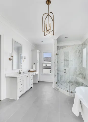 a room with white cabinets and sink