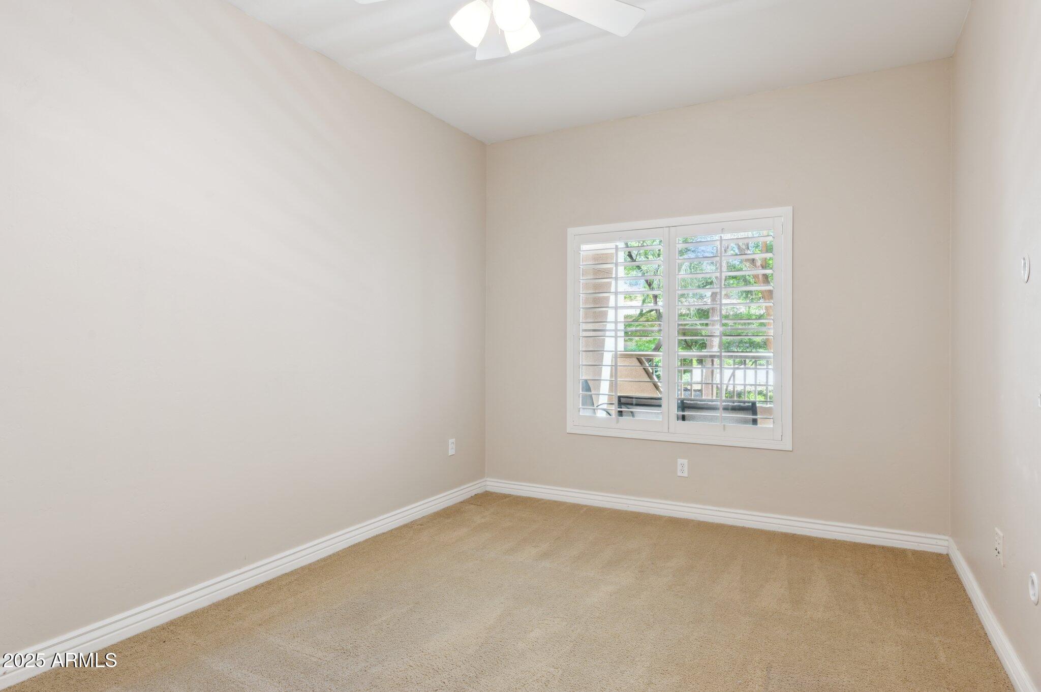 5450 East Deer Valley Drive, Unit 1214 Phoenix, AZ 85054 - Photo 14 of 35 an empty room with a window