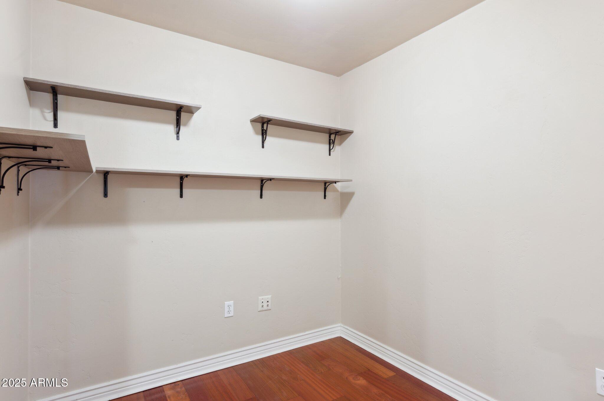 5450 East Deer Valley Drive, Unit 1214 Phoenix, AZ 85054 - Photo 18 of 35 a view of a room with racks on the wall