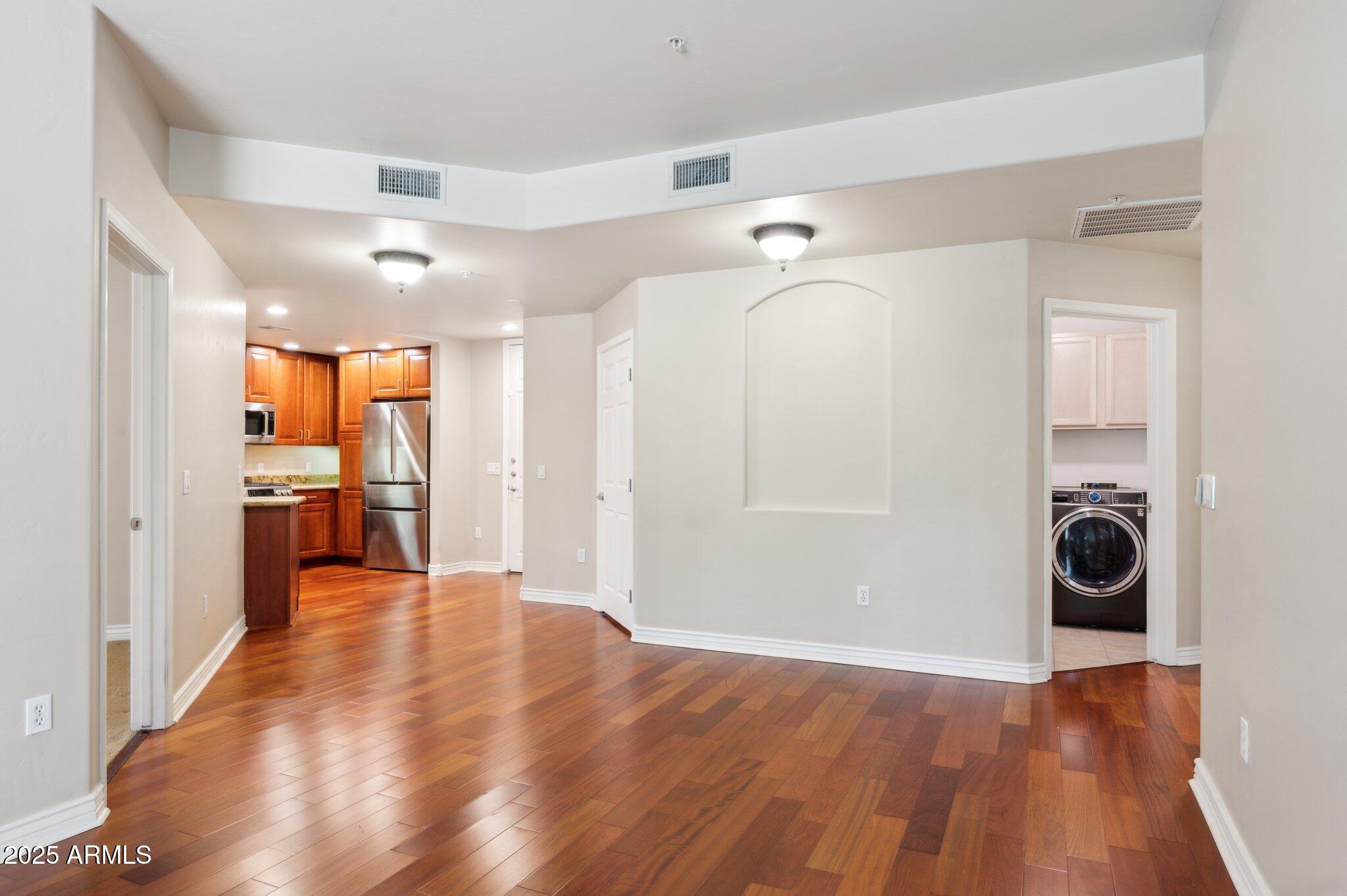 5450 East Deer Valley Drive, Unit 1214 Phoenix, AZ 85054 - Photo 20 of 35 a view of a kitchen with a refrigerator and a stove