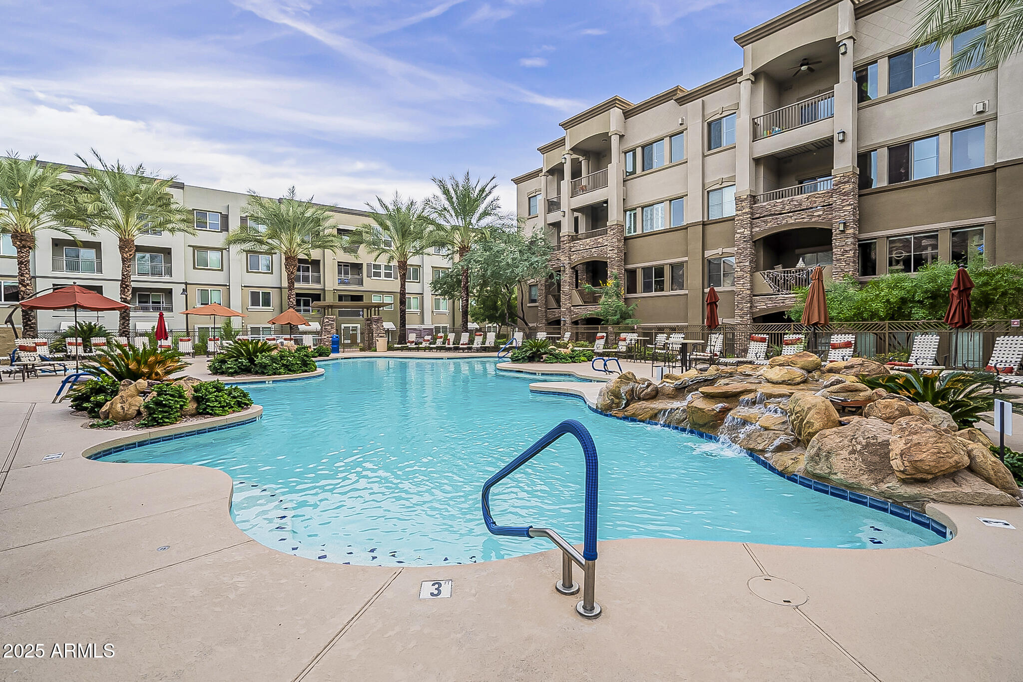 5450 East Deer Valley Drive, Unit 1214 Phoenix, AZ 85054 - Photo 28 of 35 a swimming pool with outdoor seating and yard
