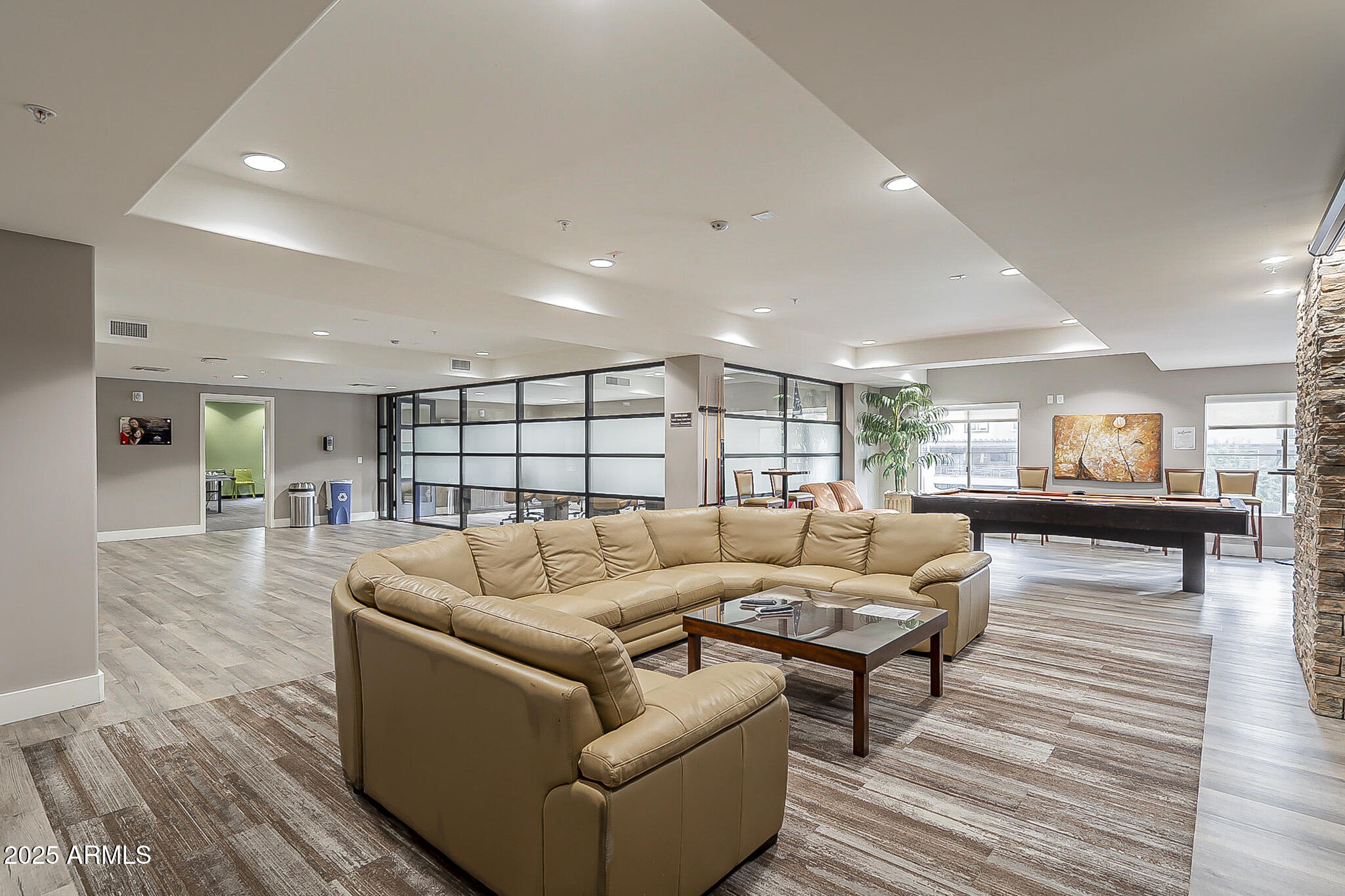 5450 East Deer Valley Drive, Unit 1214 Phoenix, AZ 85054 - Photo 31 of 35 a living room with furniture and a large window