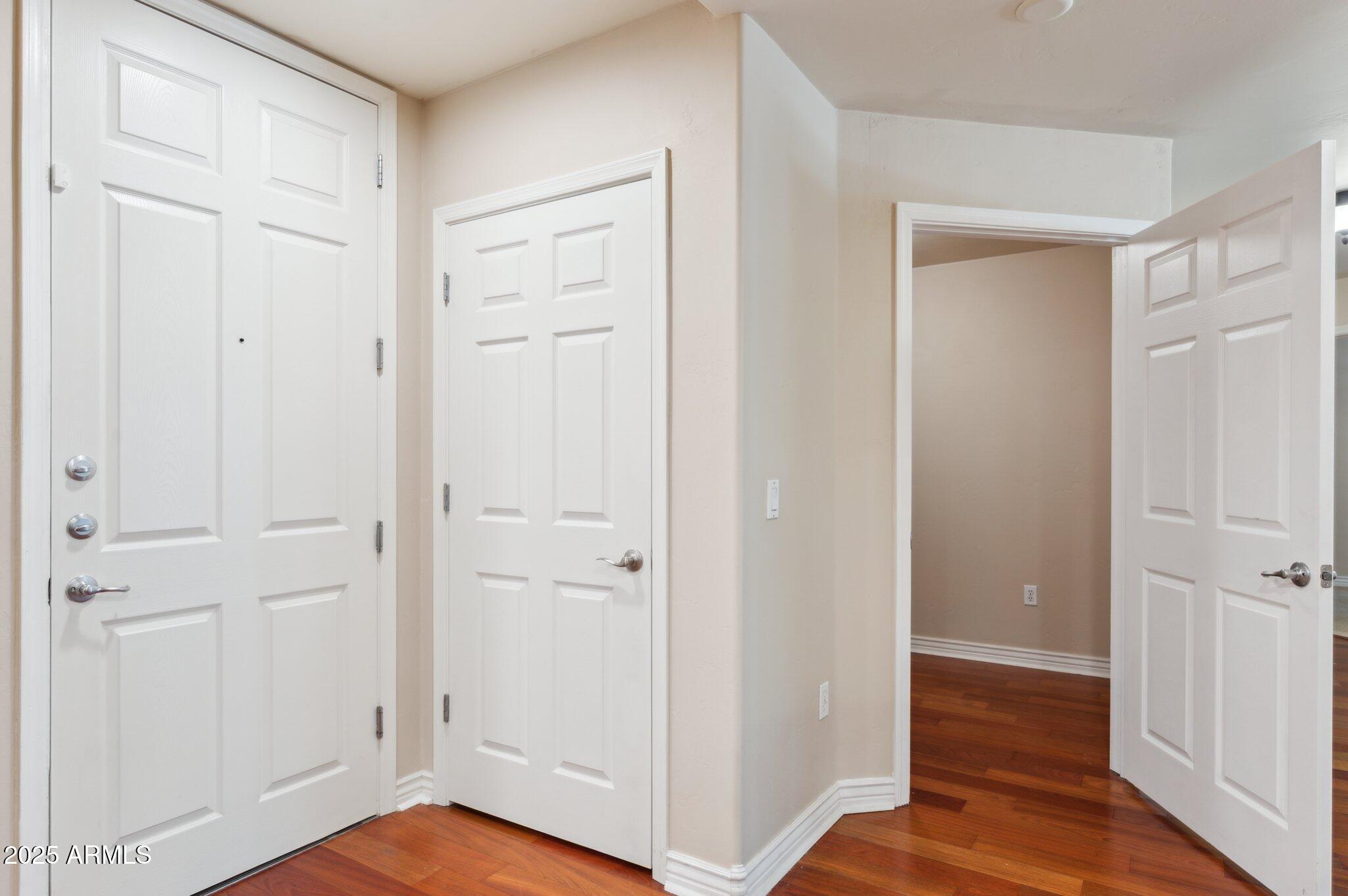 5450 East Deer Valley Drive, Unit 1214 Phoenix, AZ 85054 - Photo 34 of 35 a view of a hallway with wooden floor