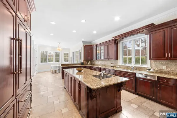 a kitchen with a sink and large window