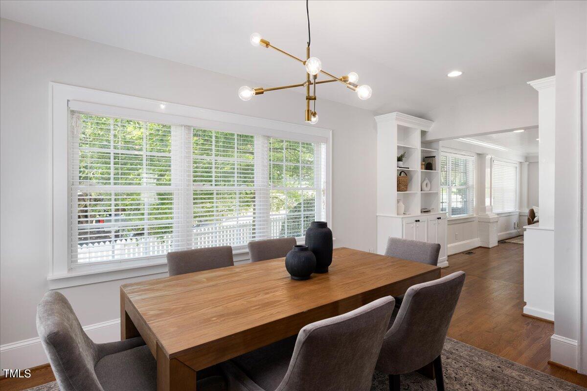 600 Harding Street Raleigh, NC 27604 - Photo 12 of 33 a dining room with a table chairs and chandelier