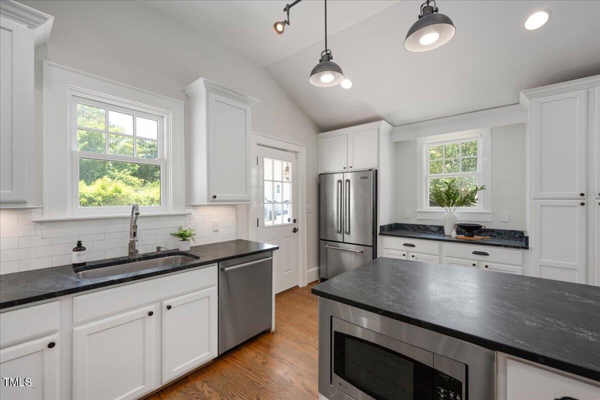 600 Harding Street Raleigh, NC 27604 - Photo 16 of 33 a kitchen with refrigerator and window