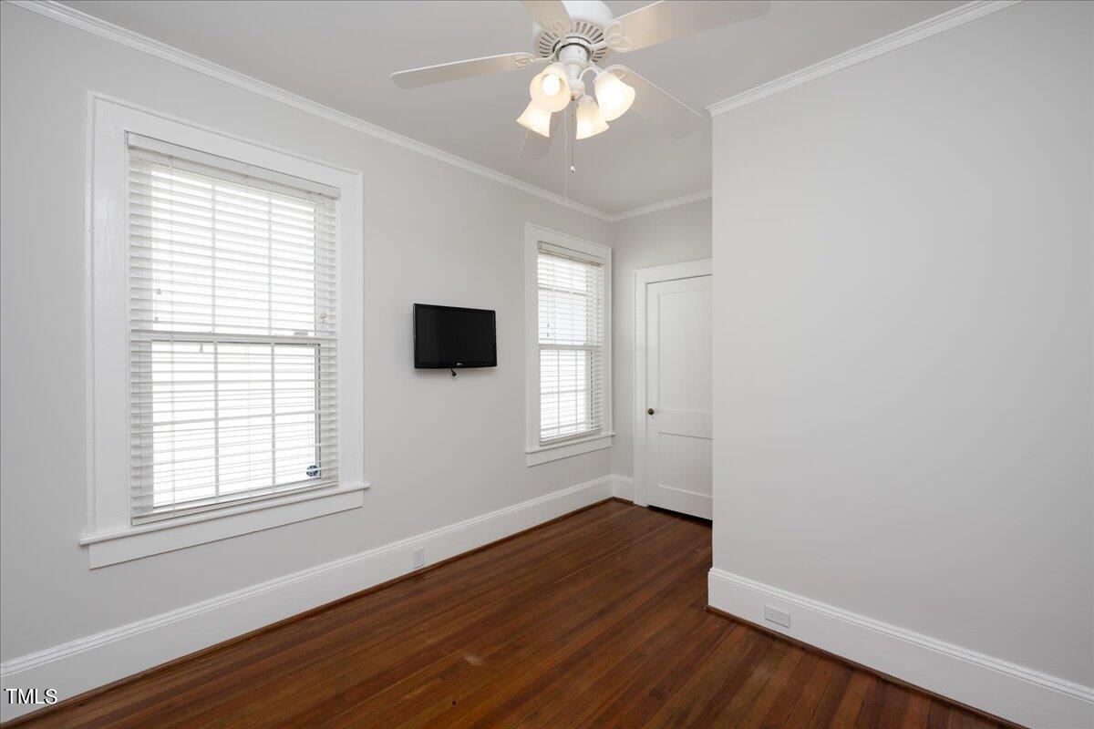 600 Harding Street Raleigh, NC 27604 - Photo 18 of 33 a view of empty room with wooden floor and fan