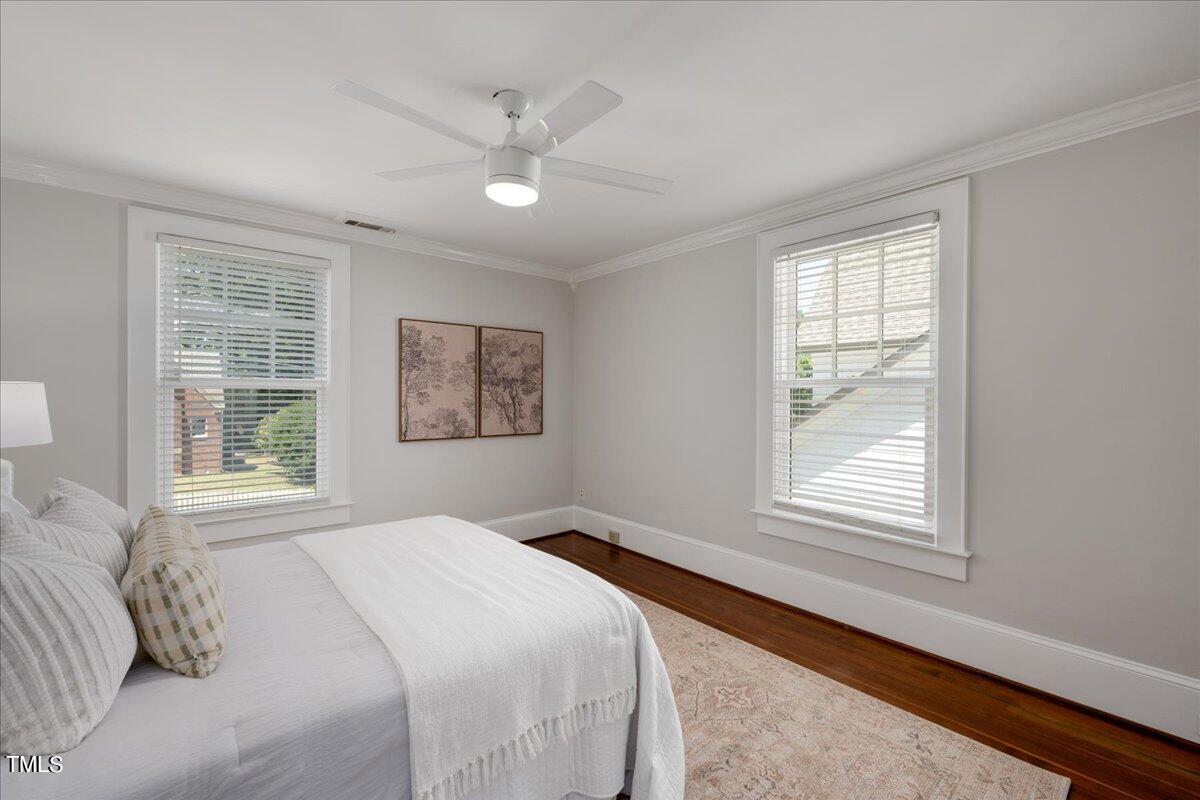600 Harding Street Raleigh, NC 27604 - Photo 23 of 33 a bedroom with a large bed and a window
