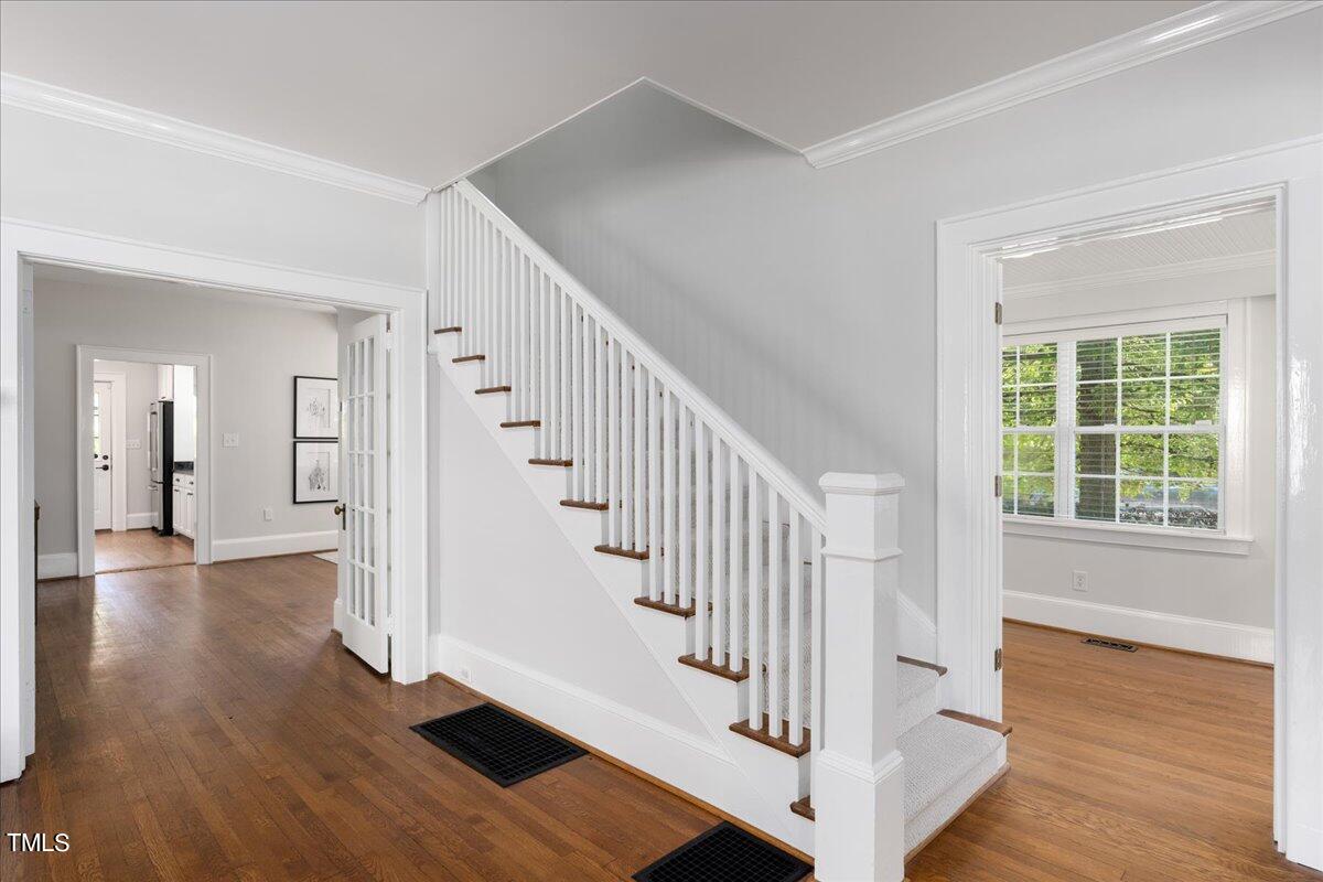 600 Harding Street Raleigh, NC 27604 - Photo 3 of 33 a view of entryway with wooden floor and stairs