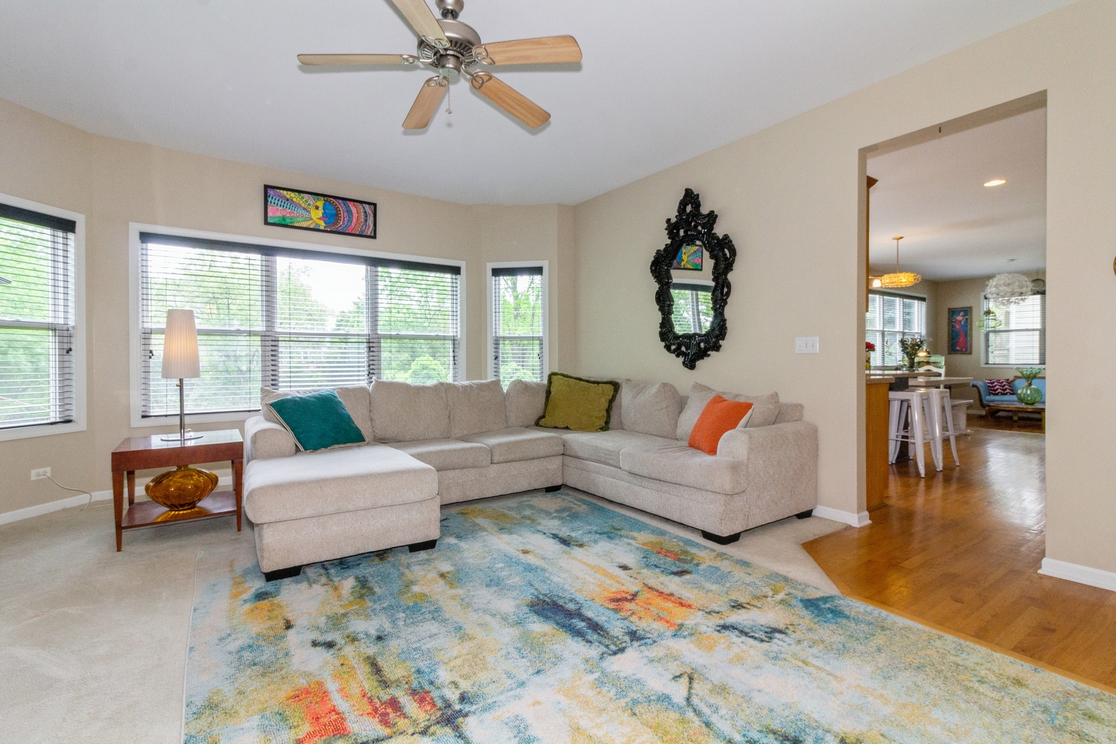 705 Queens Gate Circle Sugar Grove, IL 60554 - Photo 11 of 25 a living room with furniture and a large window