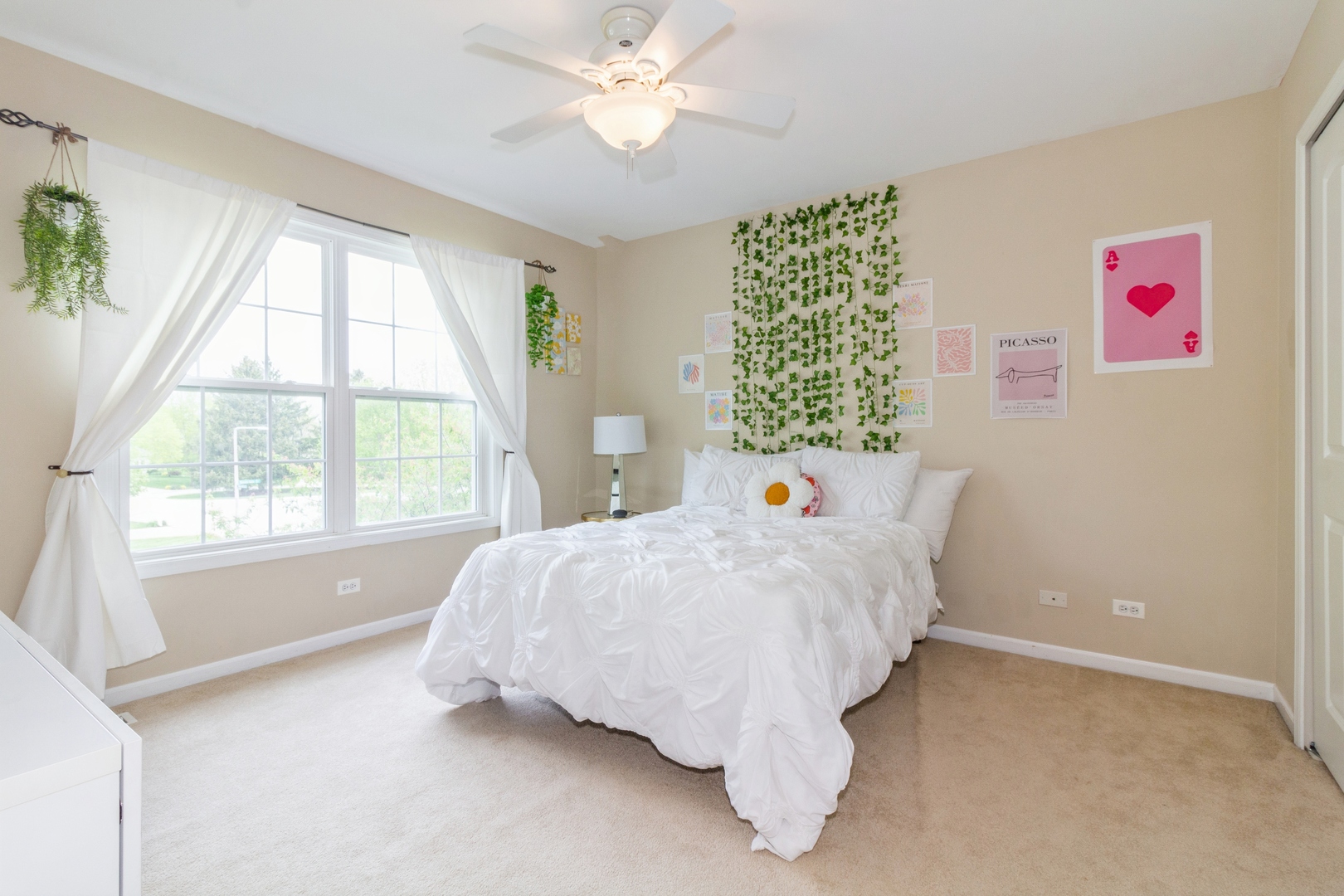 705 Queens Gate Circle Sugar Grove, IL 60554 - Photo 19 of 25 a bed sitting in a bedroom next to a window