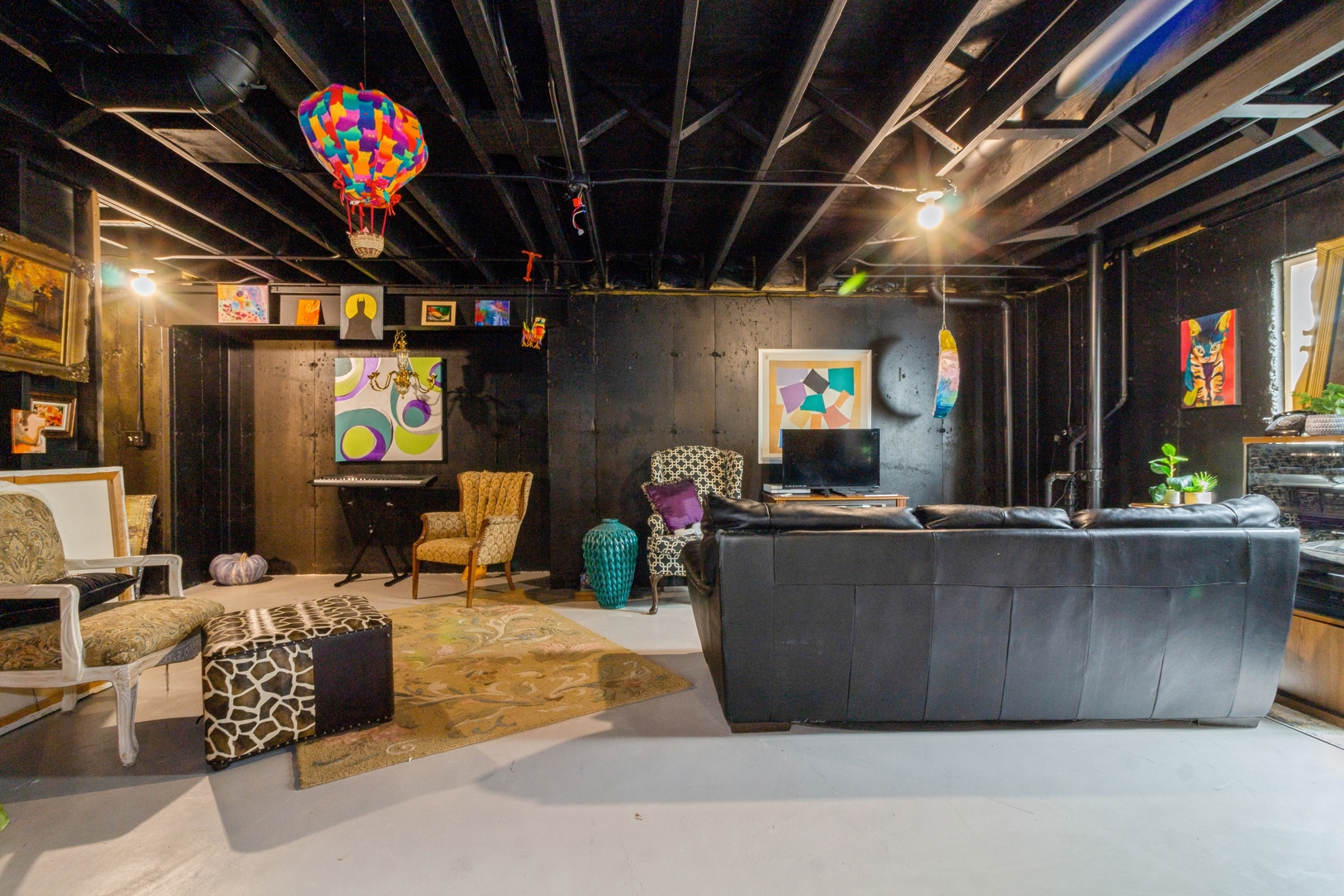 705 Queens Gate Circle Sugar Grove, IL 60554 - Photo 22 of 25 a living room with furniture and a flat screen tv