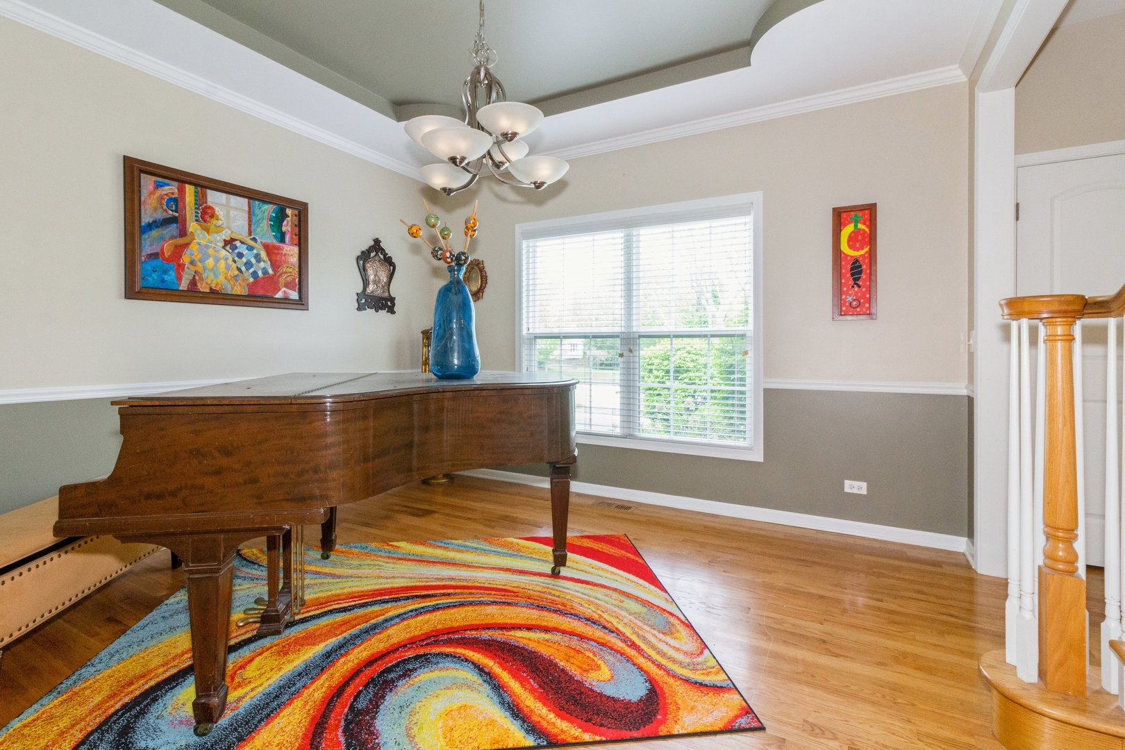 705 Queens Gate Circle Sugar Grove, IL 60554 - Photo 5 of 25 a living room with furniture and a flat screen tv