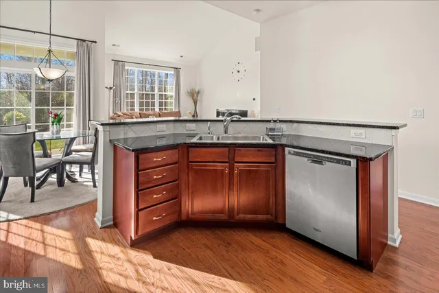 a living room with furniture a flat screen tv and a window