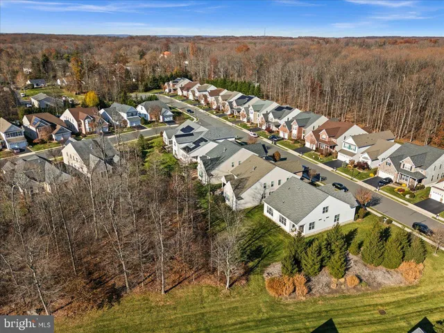 a room with furniture pool table and windows