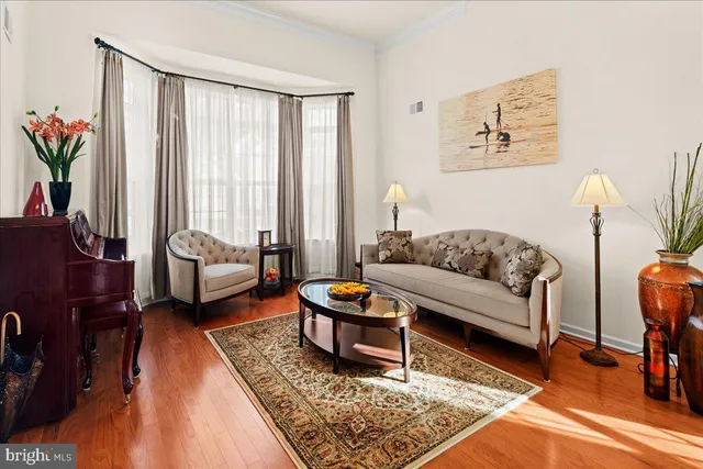 a living room with furniture and a rug