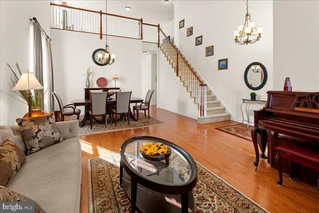 an outdoor living with furniture and a clock