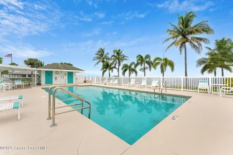 a view of a swimming pool with a lounge chairs