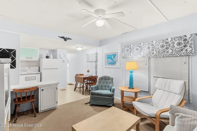 a white refrigerator freezer sitting in a kitchen