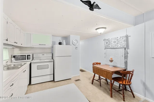 a room with furniture a washer and dryer