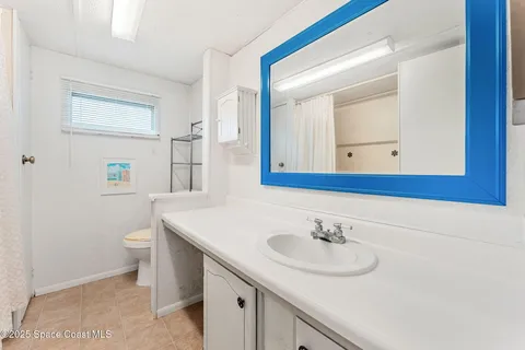 a bathroom with a tub and a shower