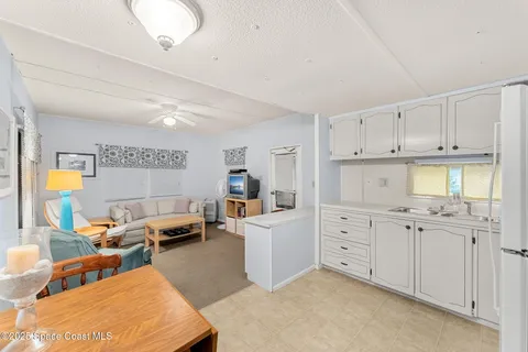 a work room with furniture and a window