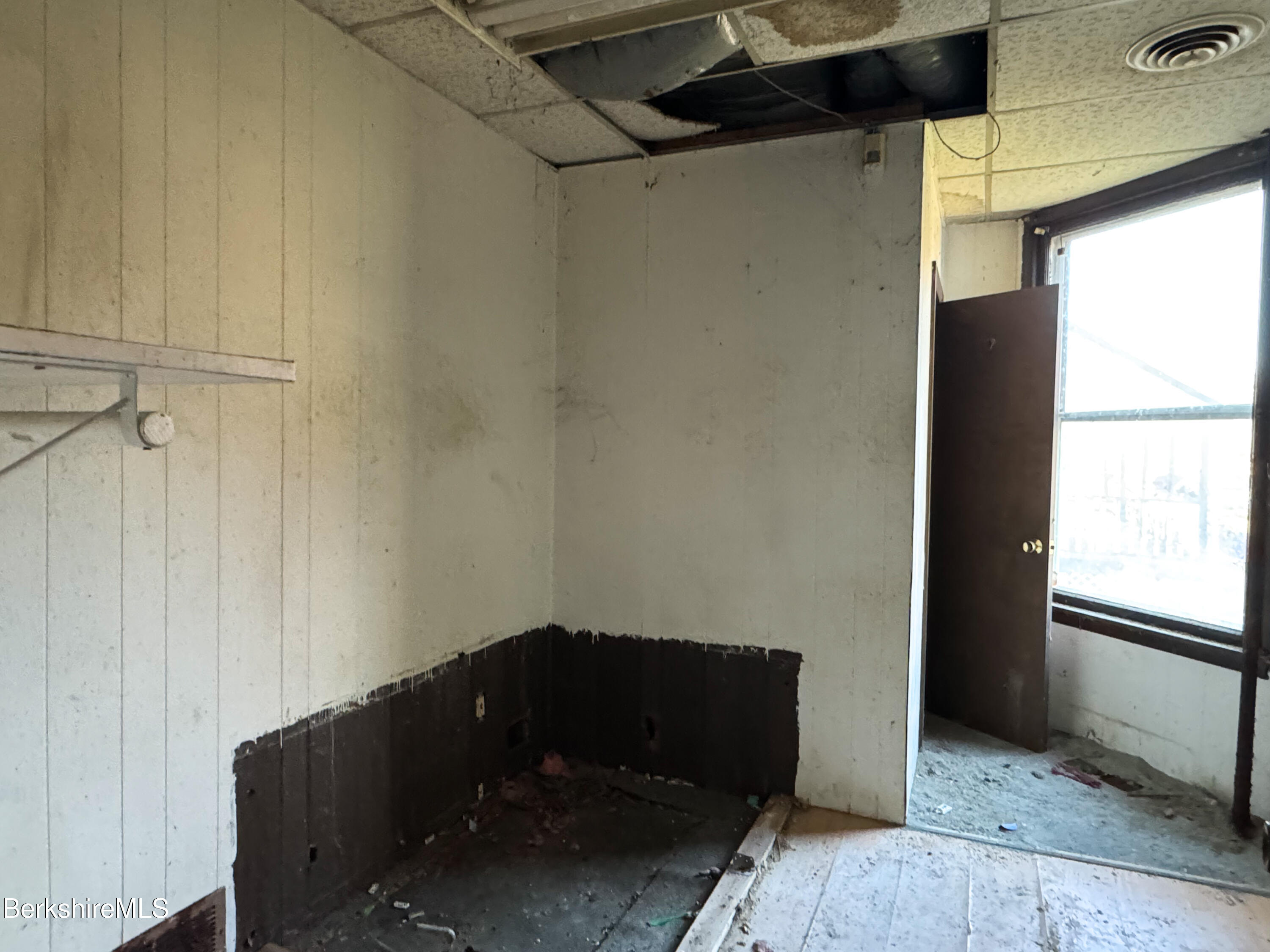 223 Elm Street Holyoke, MA 01040 - Photo 14 of 30 a view of a closet area with furniture