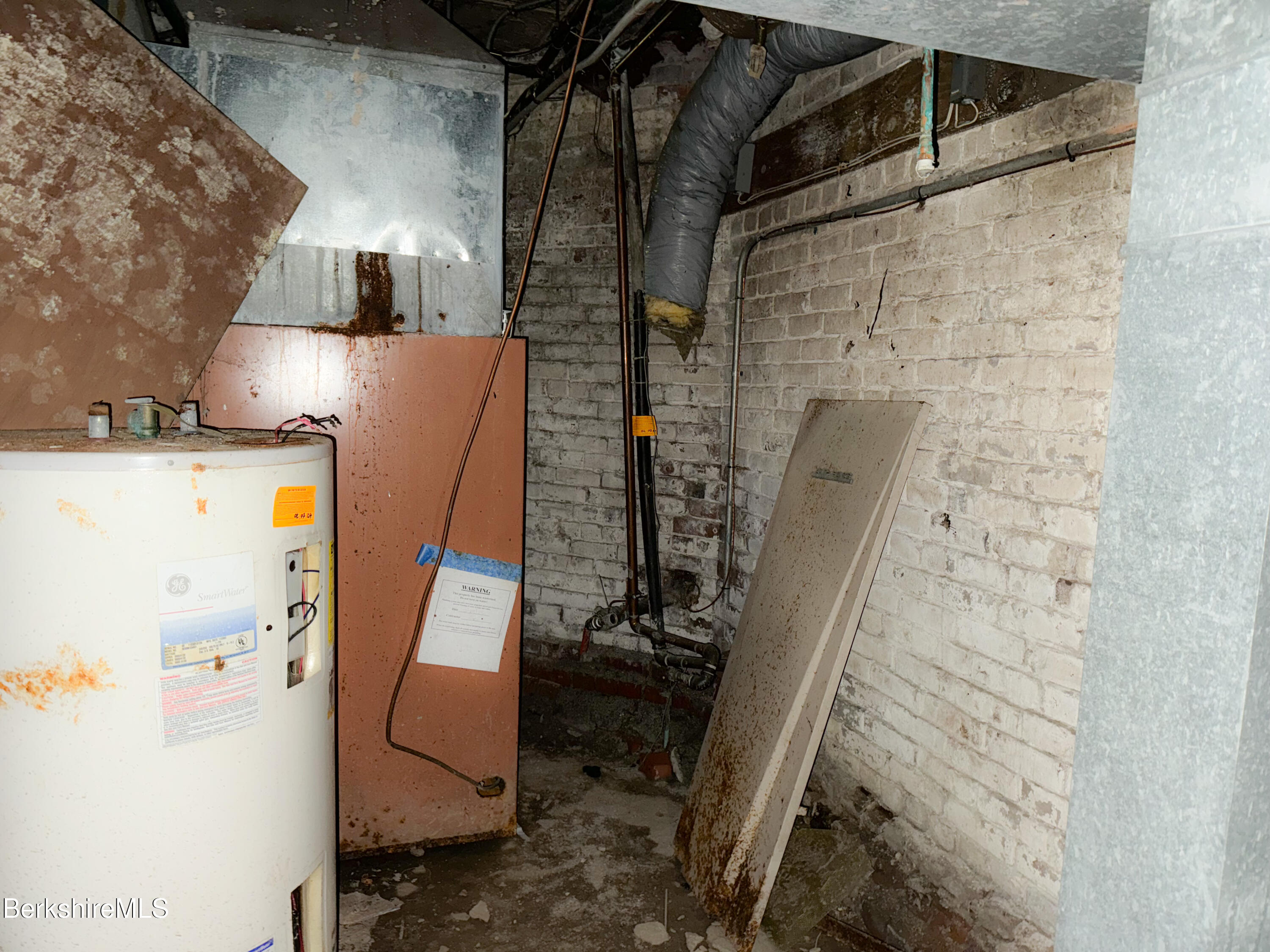223 Elm Street Holyoke, MA 01040 - Photo 29 of 30 a bathroom with a sink and mirror