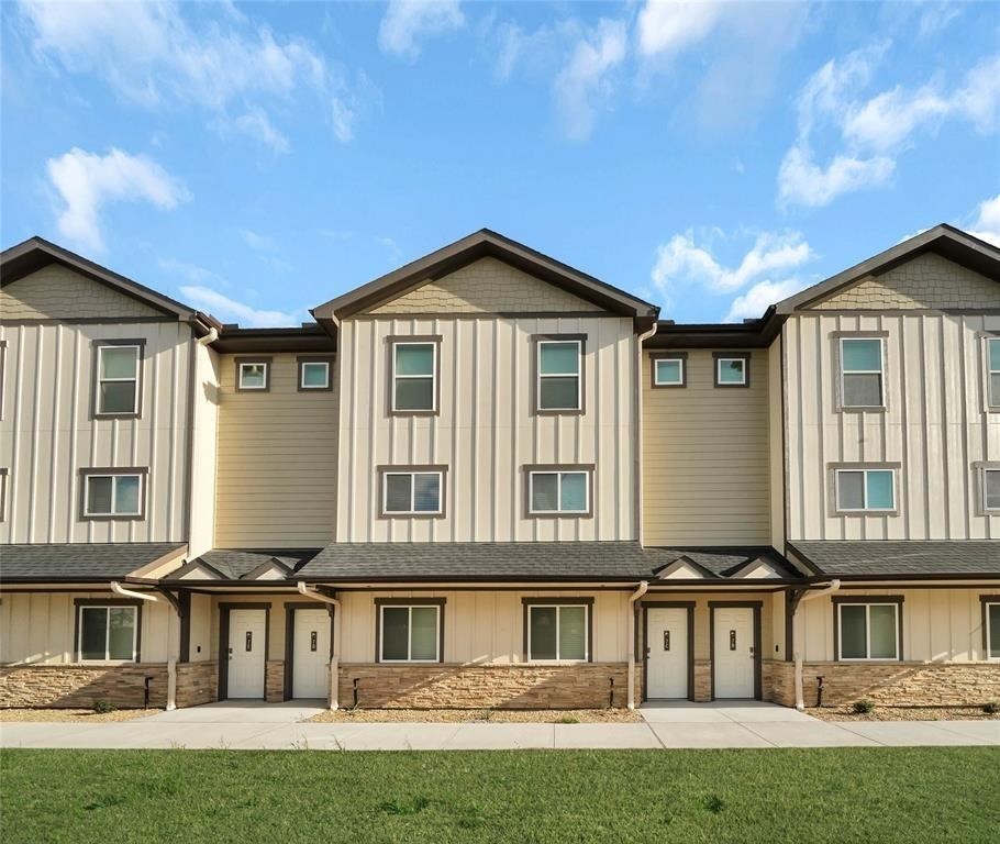 12603 Telge Road, Unit 7D Cypress, TX 77429 - Photo 1 of 19 a front view of a house with a yard
