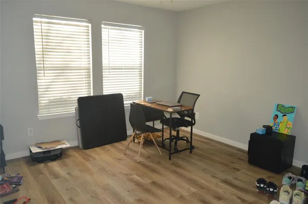 a workspace with furniture and a window