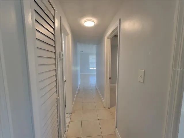 a view of a bathroom from a hallway