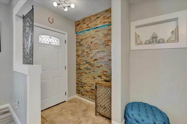 a living room with couch and a table