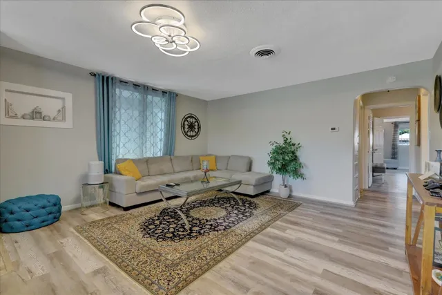 a view of a dining room with furniture and wooden floor