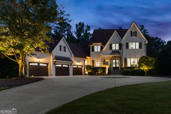 a front view of a house with a yard