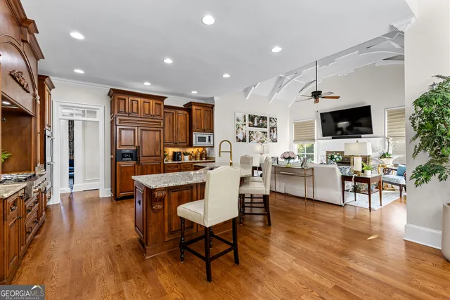 a kitchen with stainless steel appliances granite countertop a stove and a refrigerator