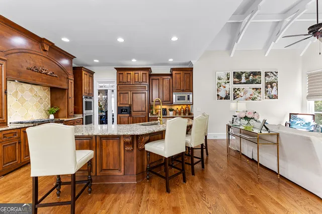 a living room with a bed furniture and a window