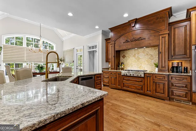 a bathroom with a granite countertop sink a mirror a shower and a bathtub