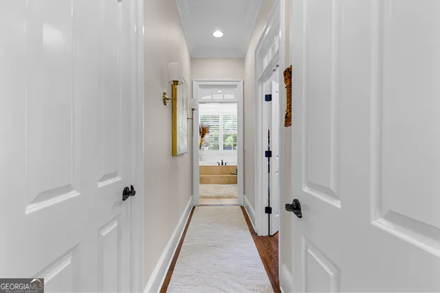 a bathroom with a granite countertop toilet sink and mirror