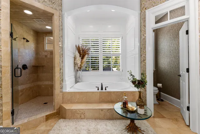 a bedroom with furniture and a window