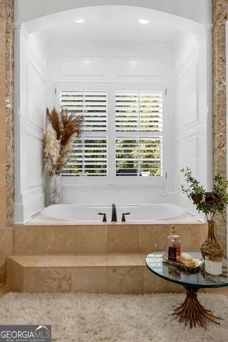 a bed room with furniture and a chandelier