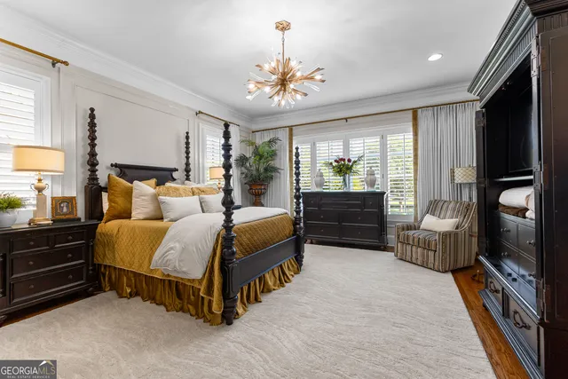 a bedroom with bed and a window