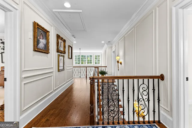 a kitchen with a table chairs sink and cabinets