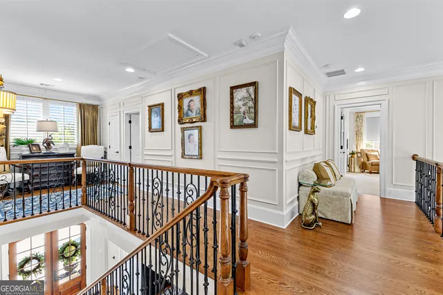 a view of a house with a big yard and sitting area