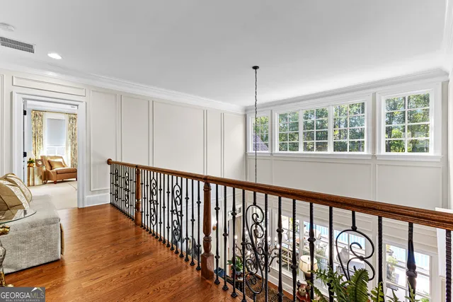 an aerial view of a house with a yard and swimming pool
