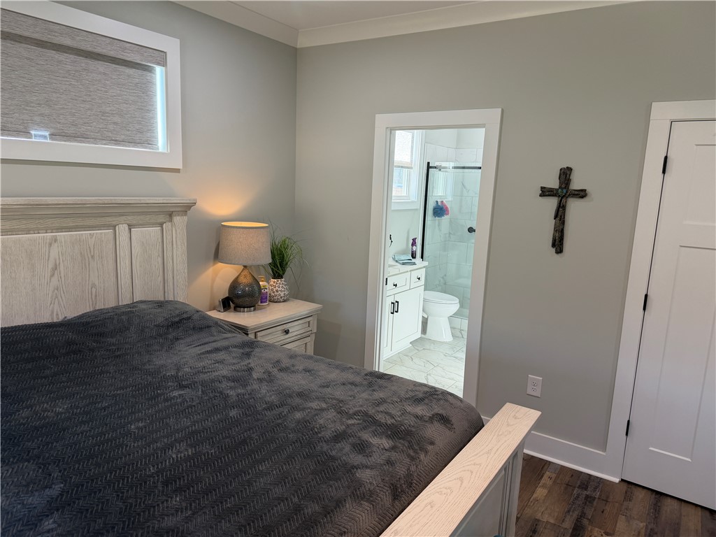 102 Turkey Trot Road Williamston, SC 29697 - Photo 17 of 37 This inviting bedroom offers comfort and a seamless transition to a private bathroom.