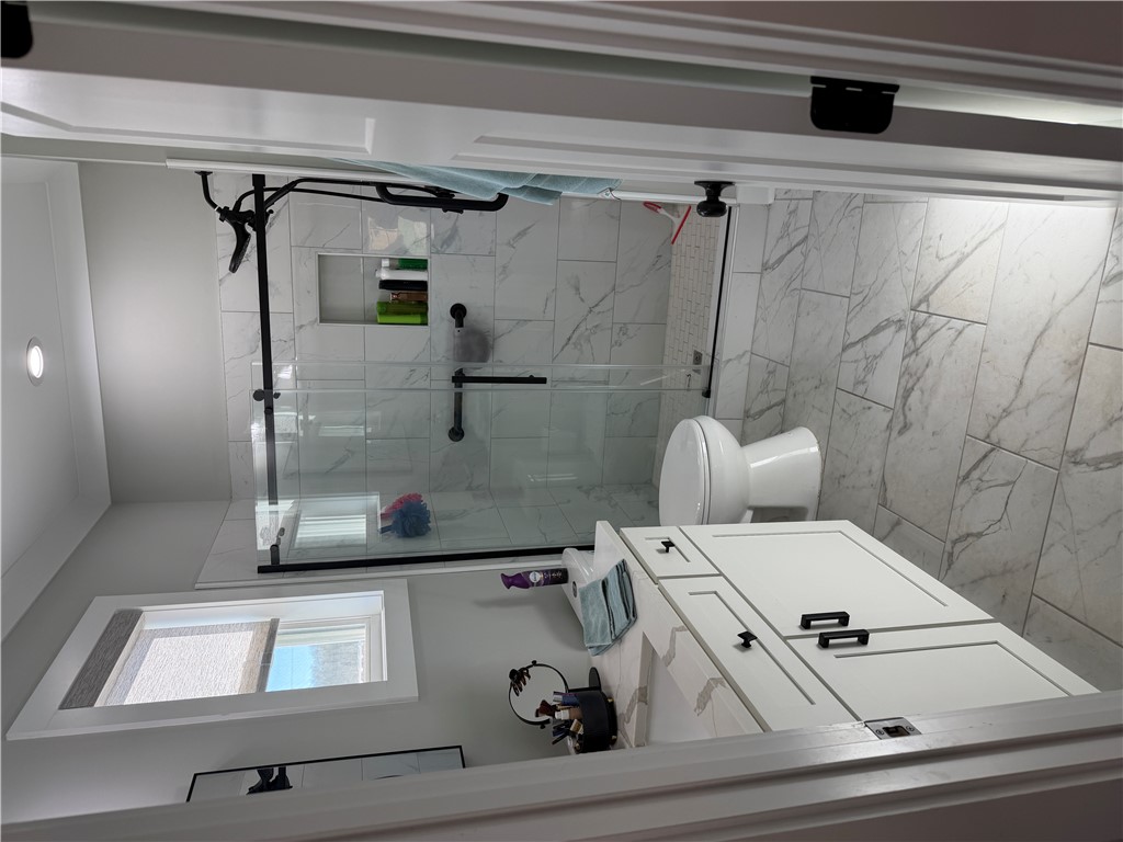 102 Turkey Trot Road Williamston, SC 29697 - Photo 18 of 37 This bright bathroom features a spacious shower and a vanity, offering comfort and convenience.