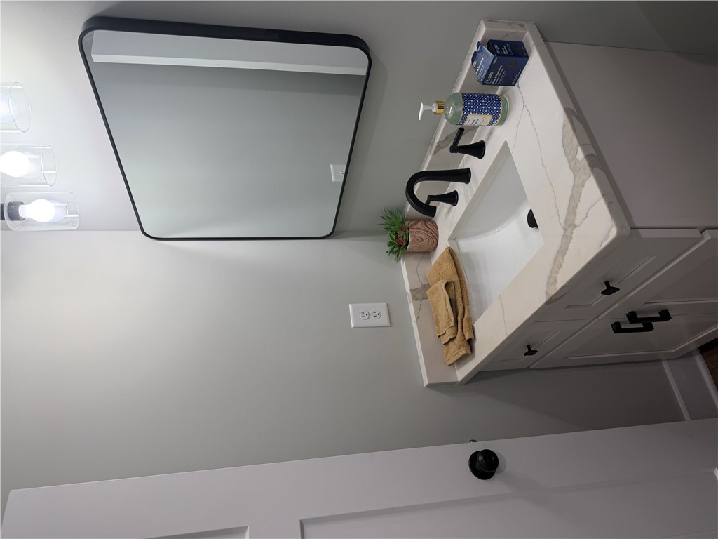 102 Turkey Trot Road Williamston, SC 29697 - Photo 26 of 37 This bathroom features a contemporary vanity with a sleek sink and elegant fixtures.